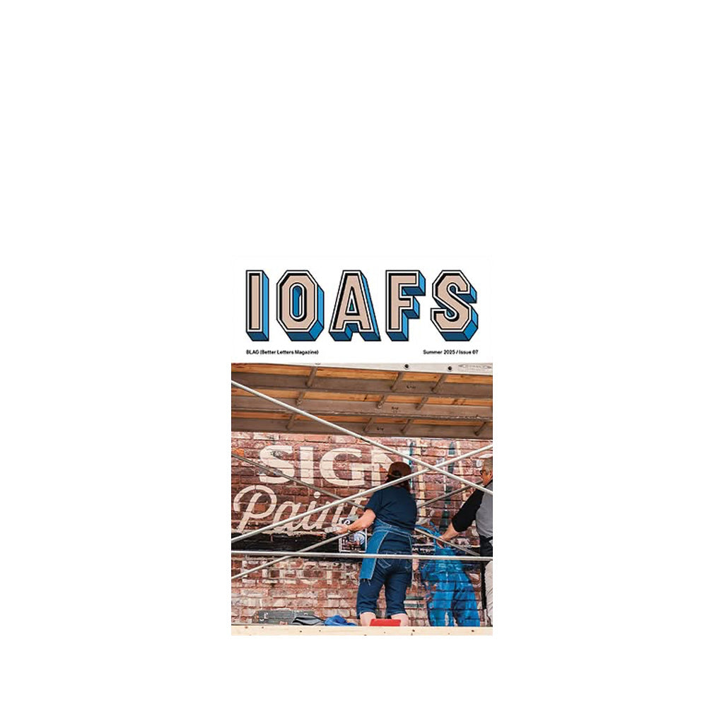 Magazine cover with masthead IOAFS set above a roughly square picture of two people on a scaffold painting lettering onto a brick wall.