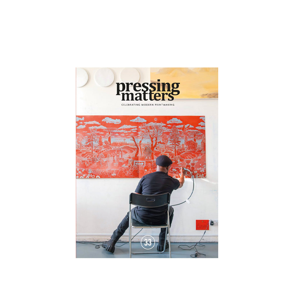 Pressing Matters cover with a person working on a large artwork