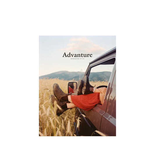 Advanture #14 cover with feet hanging out of a van window in a wheat field 