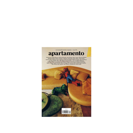Apartamento #35 magazine cover with a yellow sofa and decorative items