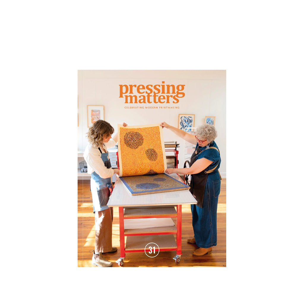 Magazine cover titled 'Pressing Matters' with two women working on a print.