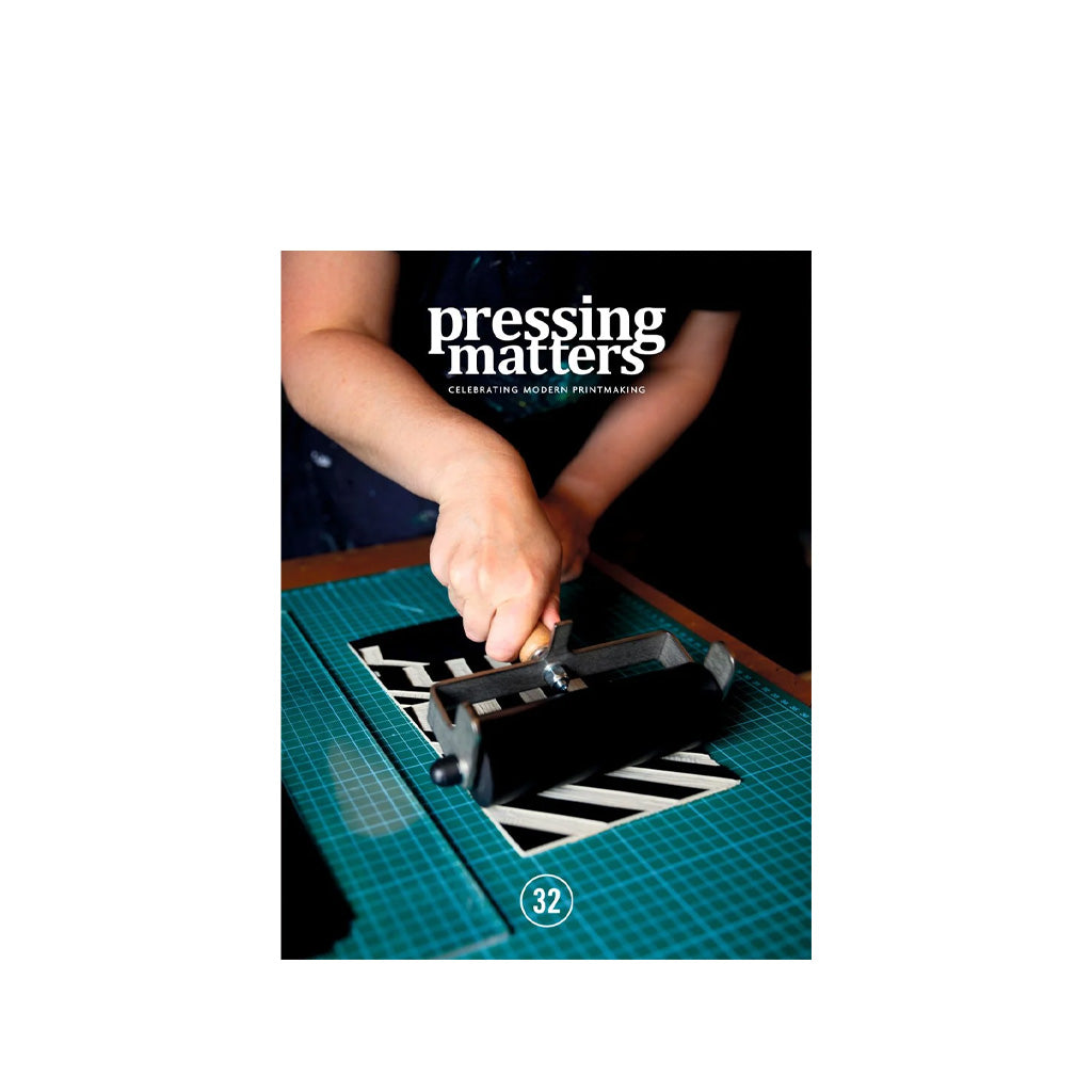Pressing Matters #32 cover with a person using a ink roller