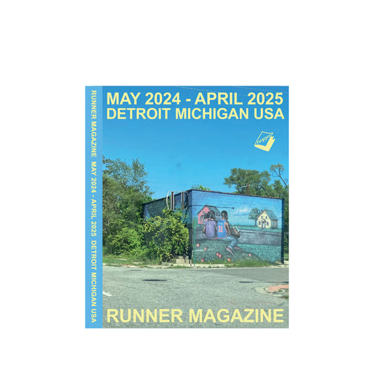 Cover of 'Runner Magazine' with a mural on a building and text indicating a long-term subscription.