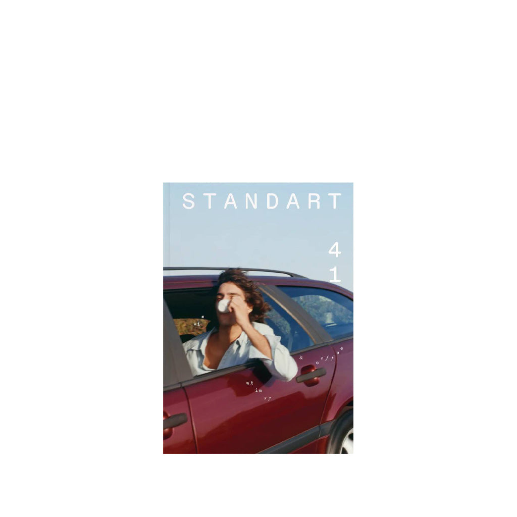 Standard #41 cover with person in a car with a scenic background